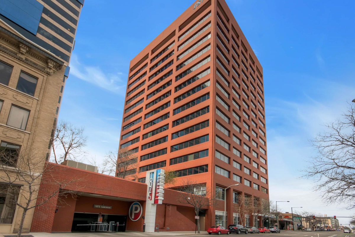 A 15-story brick and concrete building built in 1982, 1875 Lawrence is in the LoDo neighborhood of Denver.