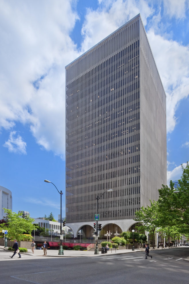IBM Plaza is a 20-story building features twelve stone arches that contain an elegant spiral staircase and a glass enclosed lobby.