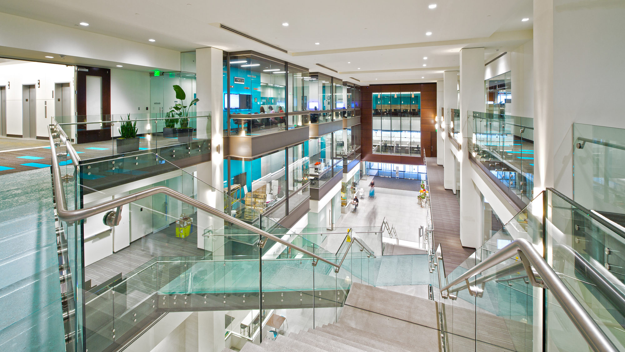 Interior of US Bancorp Tower with modern glass and wood finishes.