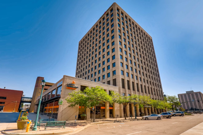 Colorado Square, a 14-story concrete office tower in downtown Colorado Springs.