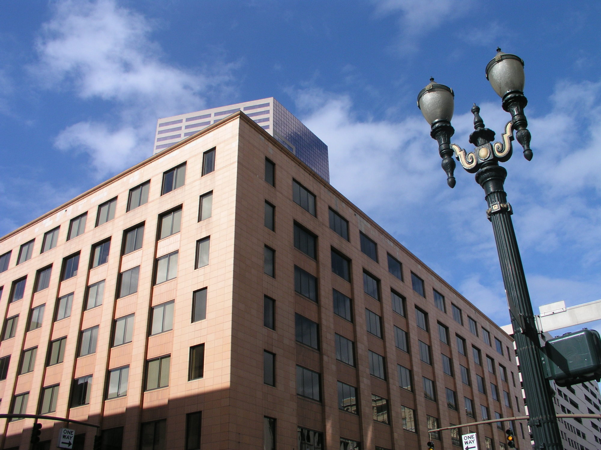 The Lincoln Building, a seven-story office building in downtown Portland, Ore. The US Bancorp Tower is visible behind it.