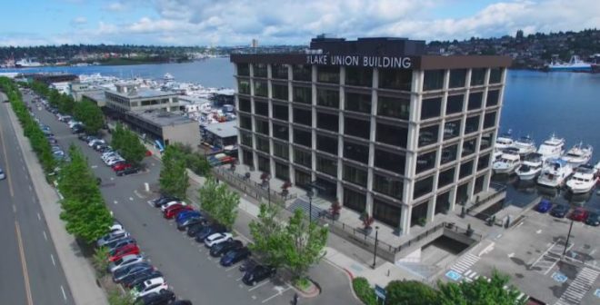 The Lake Union Building, a 90,000 square foot office building with smart electrochromic glass on all four sides, owned by Henbart.