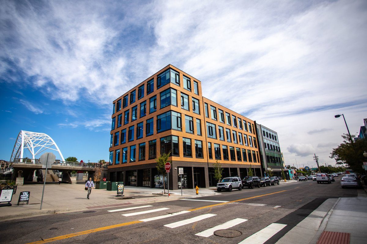 Photograph of the Circa Building delivered by Unico Properties, a commercial real estate investment firm. Circa rises above a reborn Platte Street in Denver on the eastern landing of the iconic Highland Bridge.