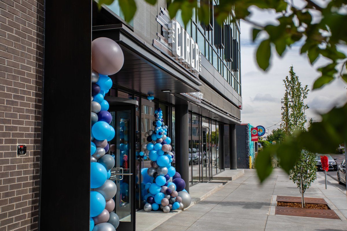 Unico Properties, a commercial real estate investment firm, celebrated the opening of Circa Building. Circa is a LEED Platinum-certified building rising above Platte Street. Photographed is the front entrance of Circa adorned with balloons arranged in a waterfall pattern framing the doors.