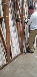 The Unico team in Portland helped salvaged building materials for creative reuse for The ReBuilding Center. In the photograph, Unico President Jonas Sylvester salvaging wood.