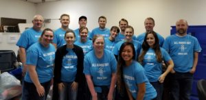 Unico employees take part in the company's first company-wide day of community service. Named "All Hands Day," the effort took place Oct. 5, 2018, across three states, six cities, and represented employees from 8 cities. Unico, a private equity real estate investment firm, is headquartered in Seattle with presence in Denver, Portland, Ore., Nashville, Austin, and Salt Lake City. In the image, a group of Unico employees pose for a group photo donning custom blue t-shirts created for the event.