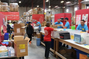 Unico employees in Denver were joined by leadership as they sorted, packed, and ship medical supplies with Project C.U.R.E.