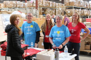 Unico employees in Denver were joined by leadership as they sorted, packed, and ship medical supplies with Project C.U.R.E. In the photograph, Unico senior vice presidents Jackie Costigan and Brian Pearce.