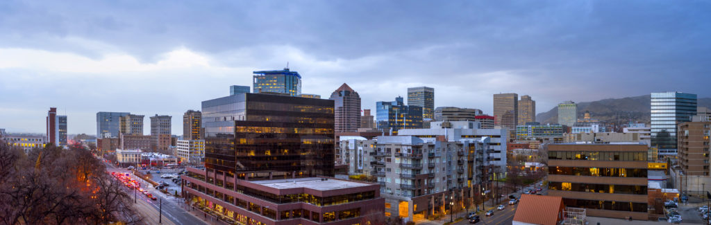 Unico, a private equity real estate investment firm, recently acquired City Centre I, a 10-story Class A office in downtown Salt Lake City. The building and downtown's skyline is photographed from atop the Salt Lake City Public Library.