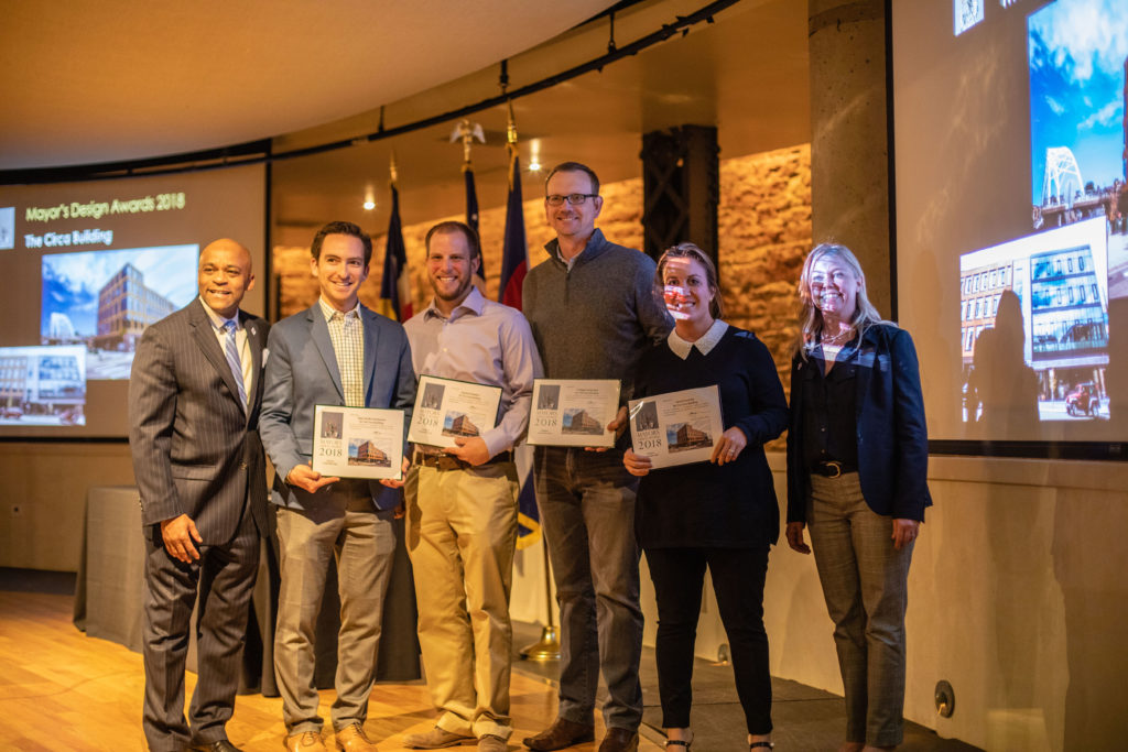 Unico and partners accepting the Mayor's Design Award for "Sustainable Style" on Nov. 8. From left to right: Denver Mayor Michael B. Hancock, Unico Associate Director Adam Knoff, Swinerton Assistant Project Manager Shelby Boardman, Unico Vice President Russ Davis, and Unico Associate Regional Director Sarajane Goodfellow.