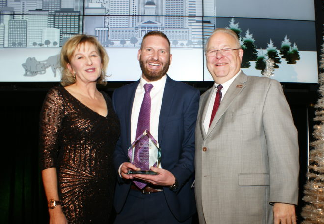 Unico Property Manager Matthew Pavlakovich, LEED AP O+M receiving the "Principal Member of the Year" award at BOMA Denvers "Mile High Awards Celebration."
