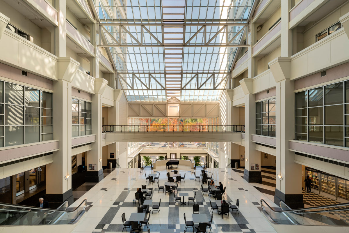 An interior photograph of the Montgomery Park building featuring the 9-story full-height glass atrium, a historic landmark acquired by commercial real estate investment company Unico Properties on Mar 20, 2019.