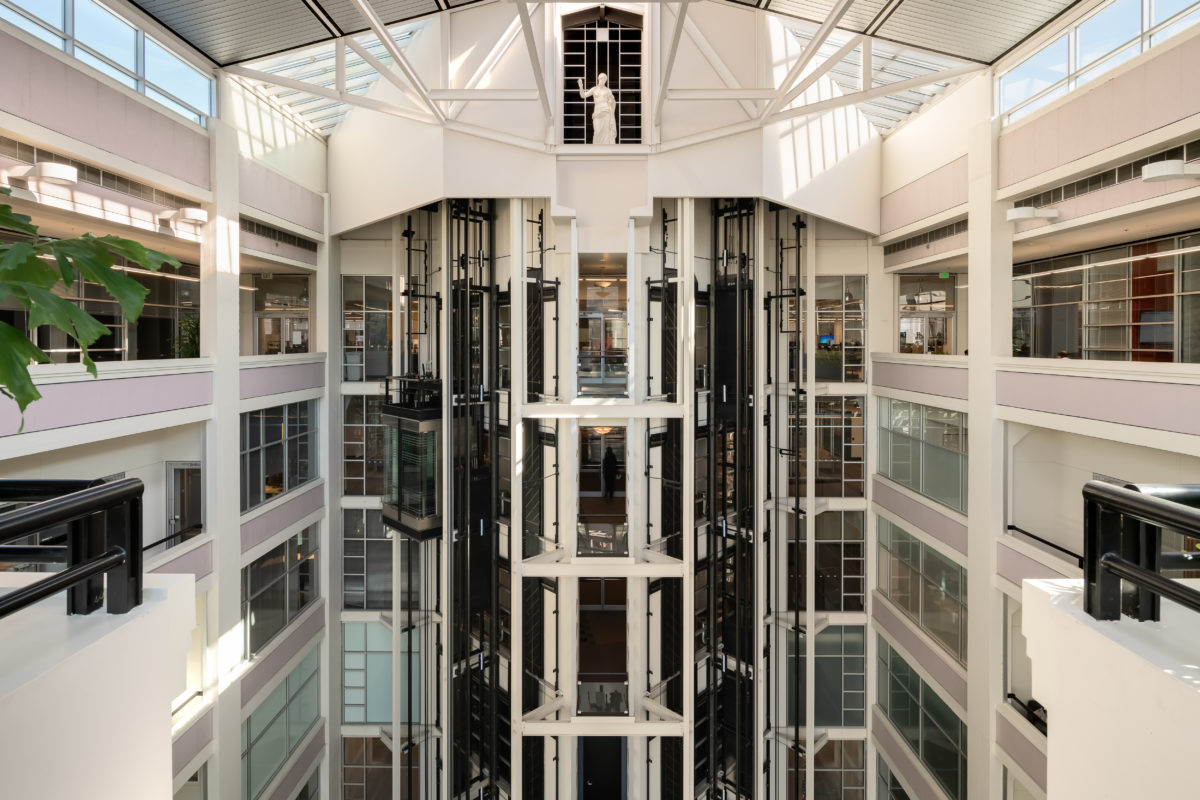 An interior photograph of the Montgomery Park building featuring the 9-story full-height glass atrium, a historic landmark acquired by commercial real estate investment company Unico Properties on Mar 20, 2019.