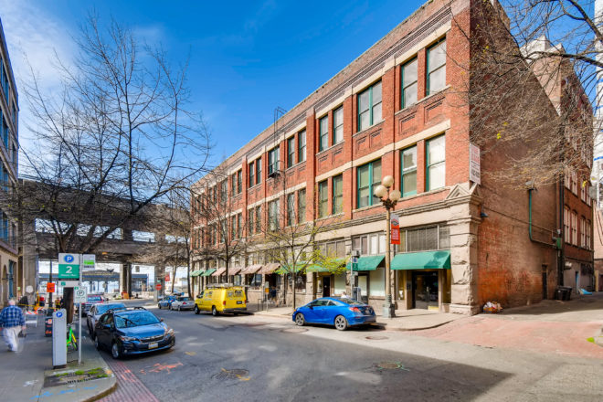 Exterior photograph of the Washington Park Building, acquired by private equity real estate investor Unico Properties in 2019.