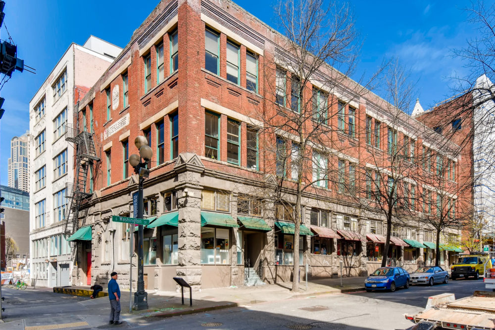Exterior photograph of the Washington Park Building, acquired by private equity real estate investor Unico Properties in 2019.