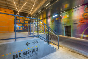 The new mural and retail space in the adjacent Printers Alley at the fully-transformed and rebranded One Nashville in downtown Nashville, Tennessee.